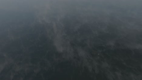 Establishing-aerial-morning-fog-covers-Moosehead-Lake