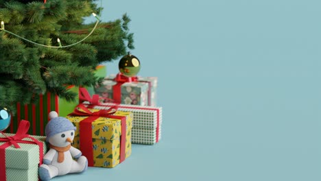 Christmas-tree-with-gifts-and-teddy-bear-with-copy-space-on-blue-background