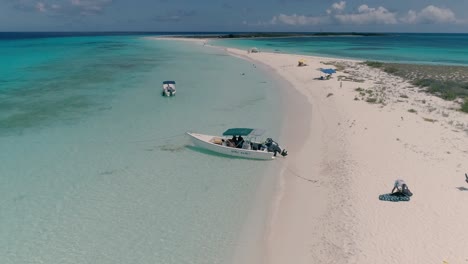 People-inside-motorboat-ready-to-leave-island,-vibes-connect-natural-world-Los-Roques-Venezuela