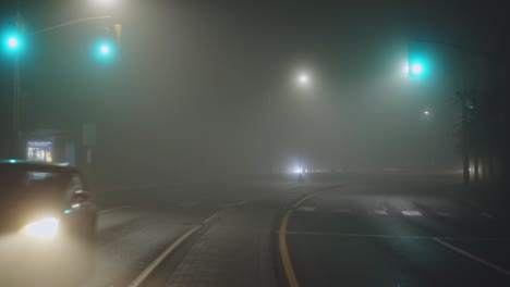 Vehicles-Traveling-On-A-Misty-Highway-During-Nighttime---wide,-static