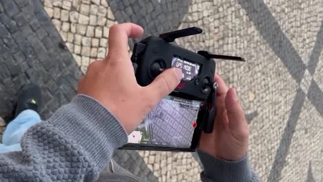 Close-up-of-Drone-Remote-Control-in-Mans-Hands