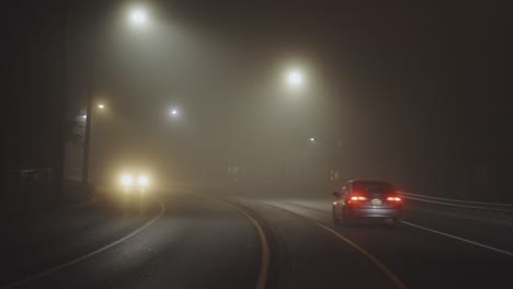 Cars-Driving-In-Foggy-Night---wide,-static