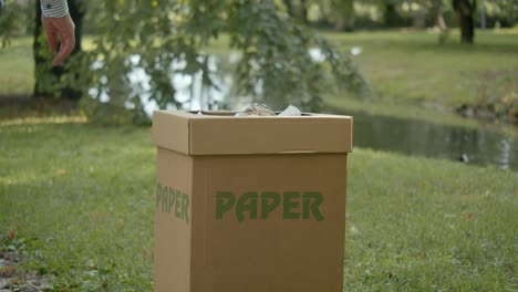 Person-Throwing-Paper-In-Paper-Garbage-Bin-Segregation-For-Recycling-Purpose