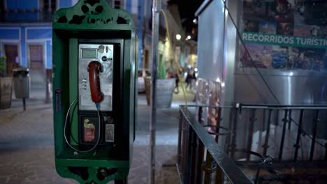 Old-telephone-booth-at-night