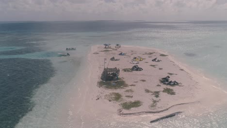 kitesurf-beach-camp-caribbean-sea,-aerial-shot-turn-around-saqui-saqui-Los-Roques-atoll