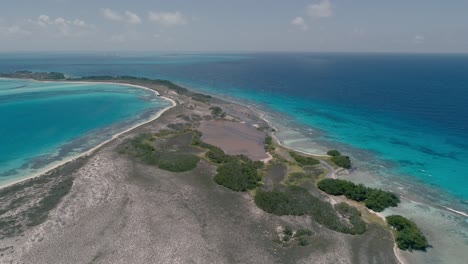 Aerial-natural-landscape-different-shades-of-blue-and-turquoise-water,-tropical-island-Los-Roques-National-park