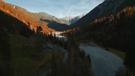 Scenic-mountain-valley-river-canyon-with-fresh-blue-water-in-the-idyllic-Bavaria-Austria-alps,-flowing-down-a-beautiful-forest-along-trees-near-Sylvenstein-Speicher-and-Walchensee