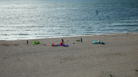 Surfers-Enjoying-Sea-Activities-On-Tropical-Hayle-Beach-In-Cornwall,-England