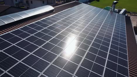 Sun-Reflection-Of-Solar-Panels-On-Top-Of-House-Roof,-Renewable-Energy-System