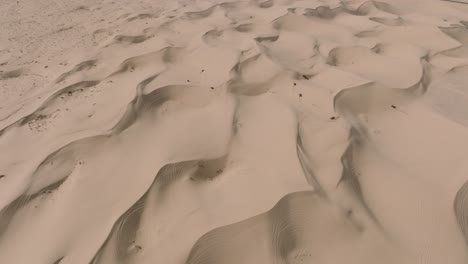 Drone-Shot-of-Off-Road-ATV-Riders-On-Sand-Dunes-in-Glamis,-California-Desert