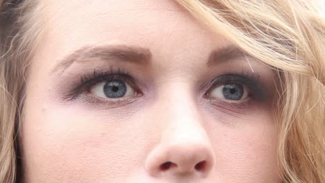 Extreme-close-up-of-attractive-woman's-eyes-looking-around-and-into-camera