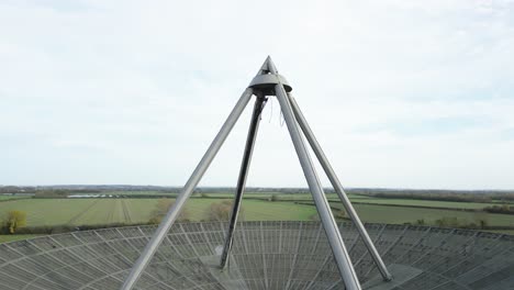 Rising-aerial-view-above-MRAO-Mullard-radio-observatory-telescope-on-Cambridge-farmland