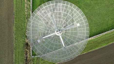 Aerial-top-down-shot-of-the-modern-radiotelescope-antenna-at-the-Mullard-Radio-Astronomy-Observatory---CCW-rotation-ascend