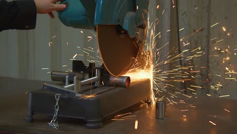 Angle-grinder-to-cut-metal-rod-at-building-site