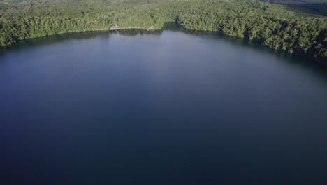Lake-Eacham-Volcanic-Crater-Lake-In-The-Atherton-Tablelands,-Queensland,-Australia---aerial-drone-shot