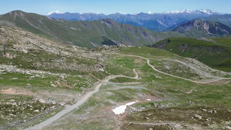 Gravel-Path-Hiking-Trail-in-Ski-Area-in-French-Alps---Aerial-Dolly-Forward