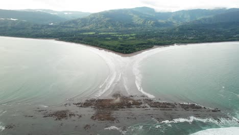 Whale-Tail-peninsula-beach-in-Costa-Rica-at-high-tide-on-cloudy-day