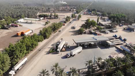 Aerial-View-Of-Fuel-Gas-Station-Beside-Road-In-Khairpur