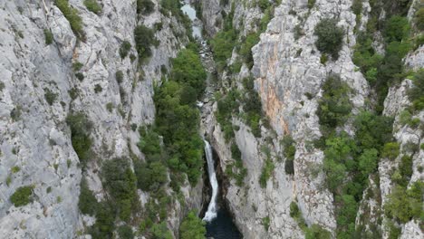 Waterfall-Gubavica-Croatia-pull-back-reveal-drone-aerial-view