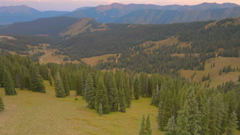 Aerial-panoramic-view-of-trees-and-valley-in-the-Colorado-Rockies-at-sunset