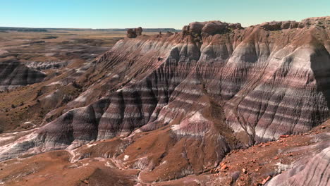Aerial-push-in-towards-colorful-painted-hills-of-Petrified-Forest-National-Park