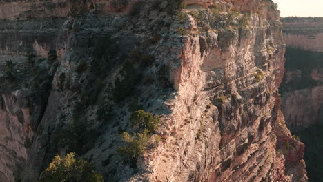Aerial-flight-up-ridge-to-top-of-sheer-cliff-in-Grand-Canyon-National-Park