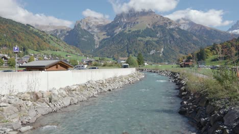 River-flowing-through-beautiful-town-Engelberg,-Switzerland