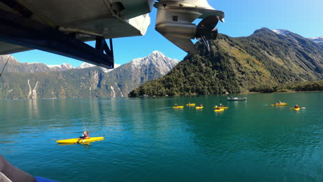 People-Kayaking-In-The-Milford-Sound-In-Summer-In-South-Island,-New-Zealand