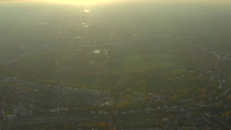 High-circling-aerial-shot-over-Regents-Park-London-against-the-sunset