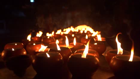 Slow-motion-view-of-burning-candles-at-night