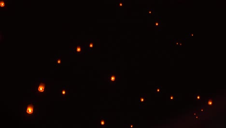 Traditional-Thai-lanterns-floating-in-dark-night-sky