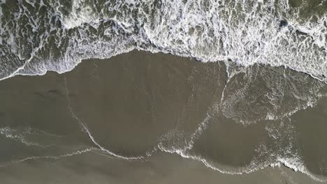 Crashing-Waves-as-Camera-Ascends,-Aerial-Drone,-Oak-Island,-NC