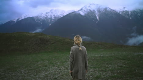 Cinematic-shoot-of-a-woman-while-hiking-outdoors-in-mountain-landscape