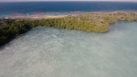 Stunning-aerial-view-tropical-archipleago-in-Los-Roques-with-lagoon,-mangrove-and-turquoise-sea-water