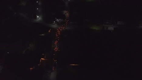 Birds-Eye-View-of-Orthodox-believers-walking-down-the-street-with-candles-for-Easter