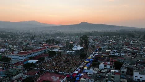 Aerial-view-towards-the-Mixquic-cementary,-during-dia-de-muertos-day-sunset-in-Mexico-city
