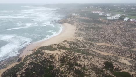 The-coastline-of-Milfontes-in-bleak-stormy-weather-Dynamic-tilting-aerial