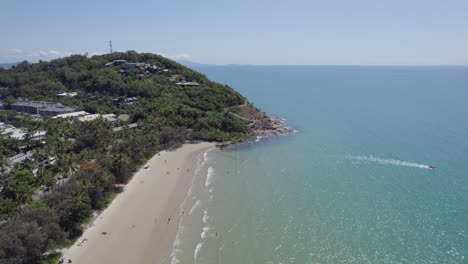 Four-Mile-Beach-With-People-Enjoying-Summer-Holidays-In-Port-Douglas,-Queensland,-Australia---aerial-pullback