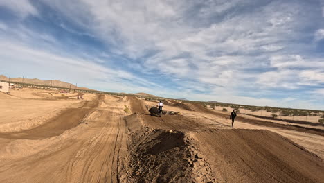 Motorcycles-racing-on-an-off-road-track---dynamic-view-from-a-first-person-view-drone