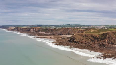 Aerial-Drone-flyover-beach-and-rocks-in-Widemouth-Bay-North-Cornwall