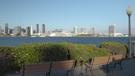 4k-Video-of-Two-Benches-Next-to-Lamp-Post-on-Coronado's-Centennial-Park-While-Facing-Downtown-San-Diego-Convention-Center-and-Amphitheatre
