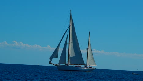 Beautiful-sailing-boat-sails-in-the-Adriatic-sea-on-a-bright-blue-calm-sunny-day