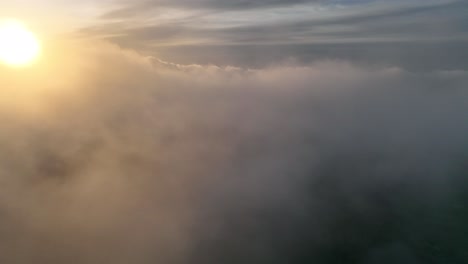 Aerial-of-amazing-view-of-clouds-passingby-sideways-during-sunrise
