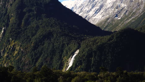 Aerial-drone-shot-of-Lady-bowens-falls-in-Milford-Sound-in-Fiordland-National-Park,-South-Island,-Southern-Alps,-New-Zealand-at-daytime