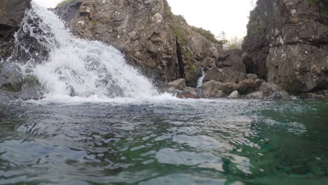 Clear-stream-running-through-two-waterfalls