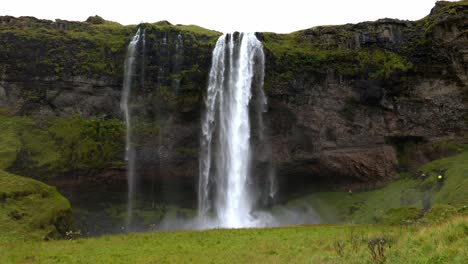 Handheld-shot-of-the-Seljalandsfoss-waterfall-in-Iceland,-most-famous-cascade-of-the-island