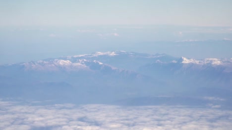 Hand-held-shot-of-the-stunning-mountain-range-above-a-wall-of-clouds-in-Greece