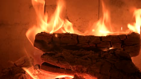 romantic-fireplace-at-home-with-fire-burning-flame-extreme-close-up