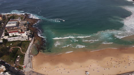 Pan-Drone-shot-of-Bondi-beach-and-out-to-sea