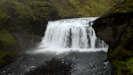 Handheld-shot-of-a-mighty-and-powerfull-big-wide-waterfall-in-Iceland